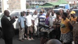Leader of the opposition Arnhim Eustace speaks with party supporters outside the courthouse after Thursday's hearing. (IWN photo)