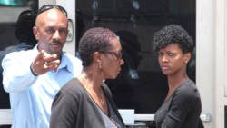 Kimesha Llewellyn, right, and her parents exit the Kingstown Magistrate's Court after her acquittal on Monday. (IWN photo)