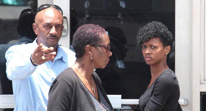 Kimesha Llewellyn, right, and her parents exit the Kingstown Magistrate's Court after her acquittal on Monday. (IWN photo)