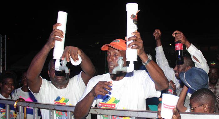 Calypso patrons show off their "rum pipes" at the semis at Victoria Park on Friday. (IWN photo)