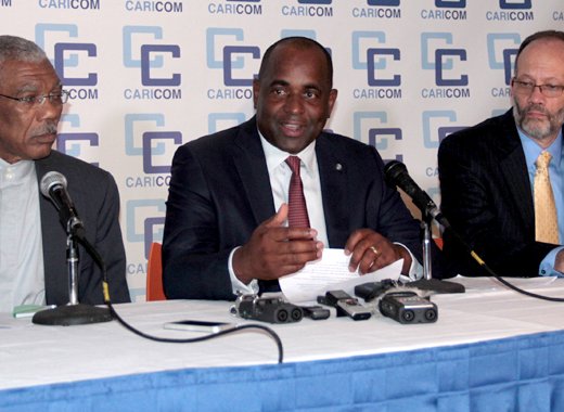 CARICOM Chairman Prime Minister Roosevelt Skerrit (center) flanked by President David Granger (left) and CARICOM Secretary General Irwin La Rocque. (CMC Photo)