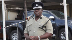 Commissioner of Police Michael Charles addresses his final Commissioner's Parade on Thursday. (IWN photo)