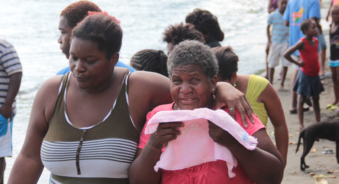 Sutherland-Sam's mother, Curl Sutherland, weeps after viewing his body. (IWN photo)