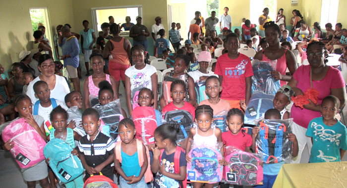 Jennifer Joseph-Butler along with children and their parents at the party in Rillan Hill on July 16. (IWN photo)