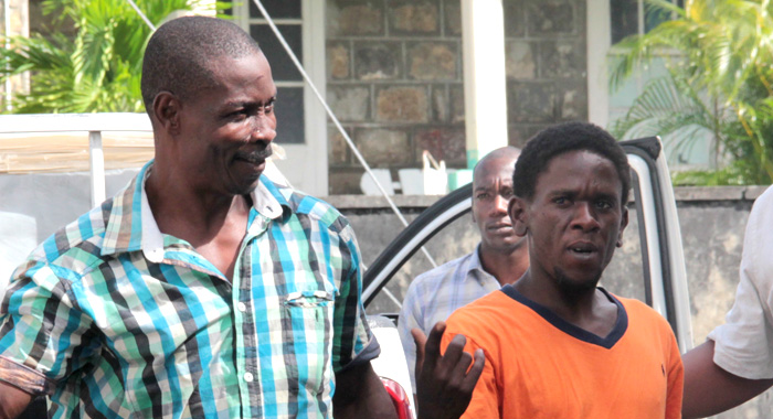 Police escort Malcolm Pollin, left, and Mark Weekes to court on Monday. (IWN photo)