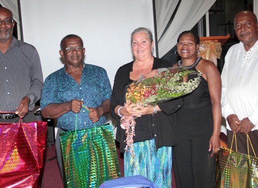 Former teachers, from left, Gordon Michael Davy, Liley Cato, Cassy-Ann Abbott, their former students, Desiree William-Richard, and former teacher Richard David Cumberbatch. (IWN photo)