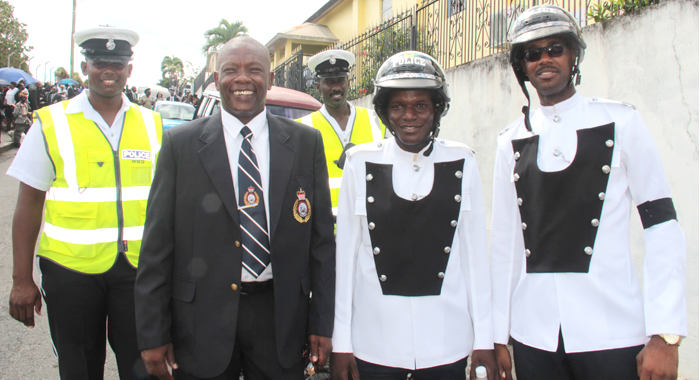 Inspector Calvin Glasgow  pos with current traffic cops at the funeral of fallen colleague, PC Giovanni Charles in Kingstown on May 14, 2016.  (IWN photo)