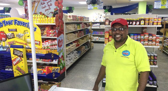 Chief Executive Officer of Coreas Distribution, Jimmie Forde, poses inside the refurbished Food Mart on Sunday -- ahead of Monday's re-opening. (IWN photo)