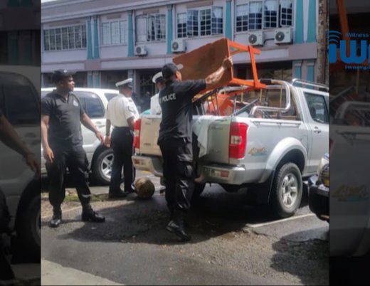 Police remove protester's possessions from the "Front Line" in Kingstown on Friday.  