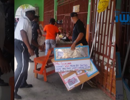 ASP Timothy Hazelwood and other police officer removed protest material from the "Frontline" in Kingstown on Friday. 