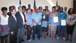 Scholarship recipients pose with Ambassador Ger, 2nd left, PM Gonsalves, third left, Minister of Education Jimmy Prince, 5th left, and La Toya Williams, furthest right, who will teach English in Taiwan. (IWN photo) 
