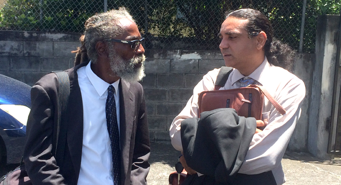 Prosecutor Carl Williams, left, and defence counsel, Ronnie Marks, chat after Tuesday's court appearance. (IWN photo)