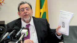 Prime Minister Dr. Ralph Gonsalves on Tuesday holds up a copy of his paper on SVG-Taiwan ties. (IWN photo)