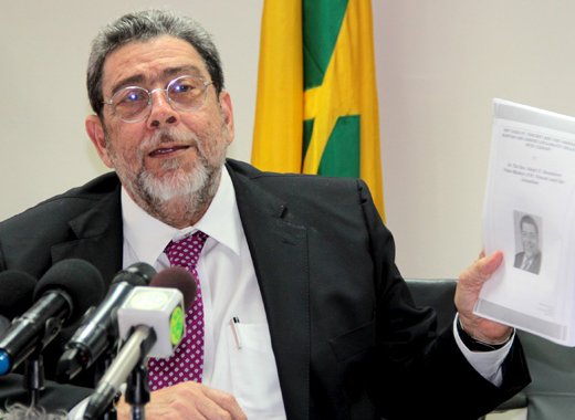 Prime Minister Dr. Ralph Gonsalves on Tuesday holds up a copy of his paper on SVG-Taiwan ties. (IWN photo)