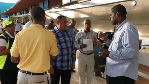 Captain Stephen Russell, Director, NEMA, right, chats with Prime Minister Perry Christie, centre, before setting off on Saturdays recognisance flight. (PHOTO: NEMA)