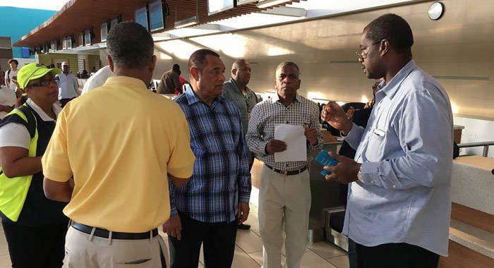 Captain Stephen Russell, Director, NEMA, right, chats with Prime Minister Perry Christie, centre, before setting off on Saturdays recognisance flight. (PHOTO: NEMA)