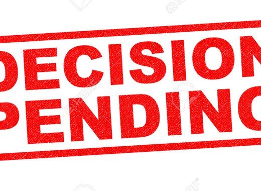 DECISION PENDING red Rubber Stamp over a white background.