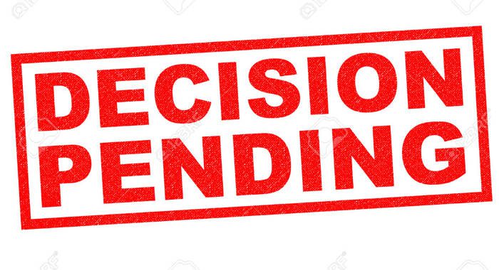 DECISION PENDING red Rubber Stamp over a white background.