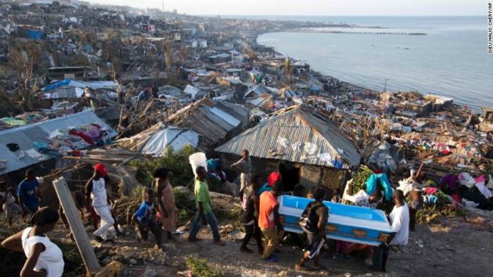 In Jeremie, Haiti, Hurricane Matthew claimed the life of a pregnant woman, whose remains were carried in a coffin by local residents on Friday, October 7, 2016. (CNN photo)
