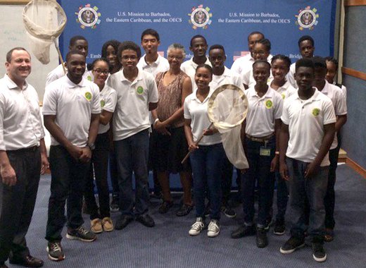Participants of the citizen scientists workshop pose for a group photo with presenter Dr. Gillian Bowser, and Deputy Public Affairs Officer Jeff Barrus at the conclusion of the session at the SVG Community College.