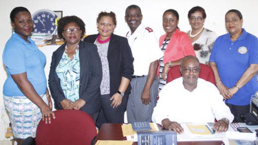 Minister of National Mobilisation, Frederick Stephenson, seated, and member of the Adoption Committee. (IWN photo)