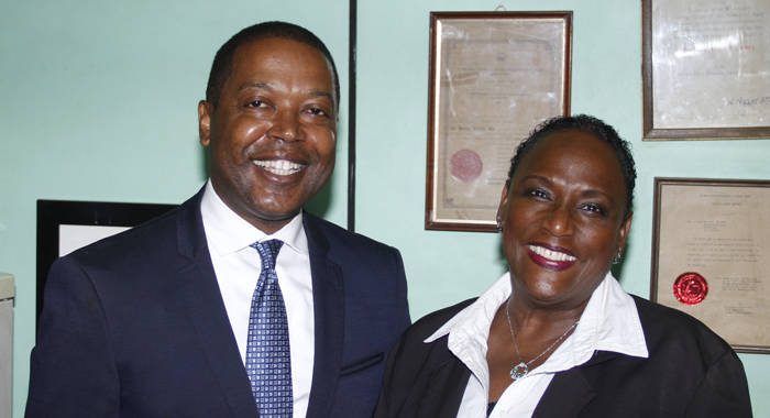 Ben Exeter, right, poses with his lawyer, Kay Bacchus-Baptiste, at her chambers in Kingstown after Monday's court ruling. (IWN photo)