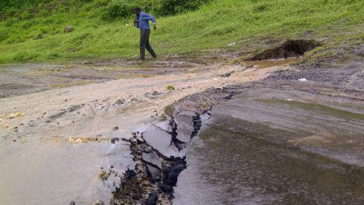 The road just outside the Argyle International Airport collapsed Thursday afternoon. (Photo: Drahcir Notla Enworb/Facebook) 
