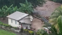 A house damaged as a result of the heavy rains and floods.