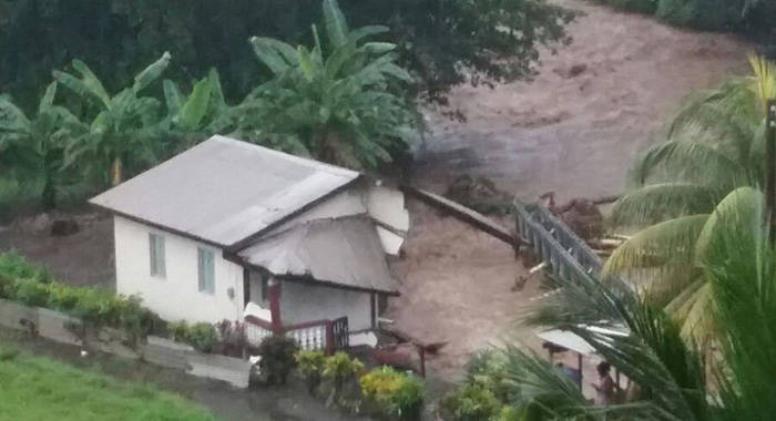 A house damaged as a result of the heavy rains and floods.