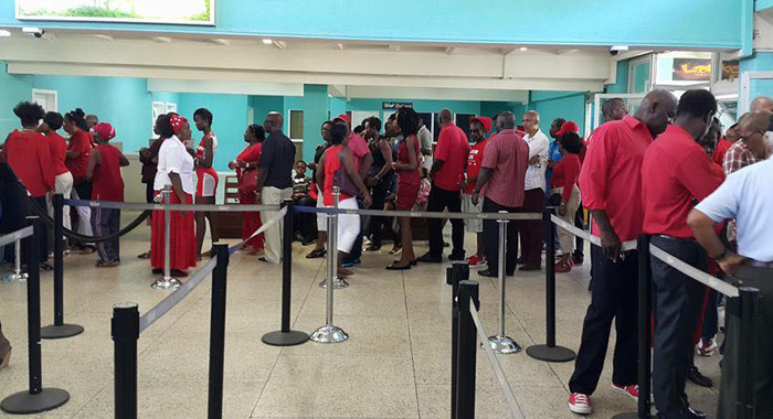 ULP failthfuls queue up to check in last December for the 10-minute flight from Arnos Vale to Argyle that formed part of the ULP's campaign strategy. Almost a year later, the airport remains incomplete.