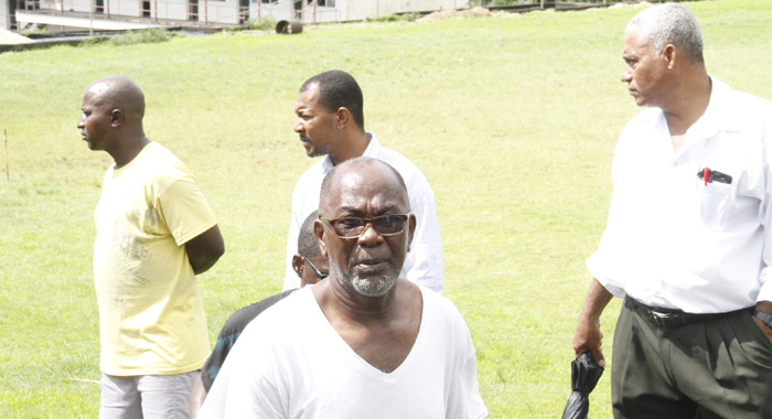 MP for Central Kingstown, St. Clair Leacock and other persons at the scene in New Montrose. (IWN photo)