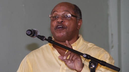 Chair of the main opposition New Democratic Party (NDP), Dr. Linton Lewis, speaks at the party's convention on Sunday. (IWN photo)