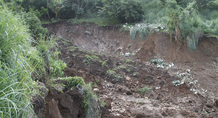 The landslide took a chunk of the hillside with it. (IWN photo)