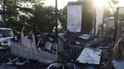 The burnt out house in Upper Questelles. (IWN photo)