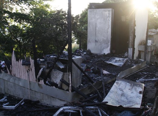 The burnt out house in Upper Questelles. (IWN photo)