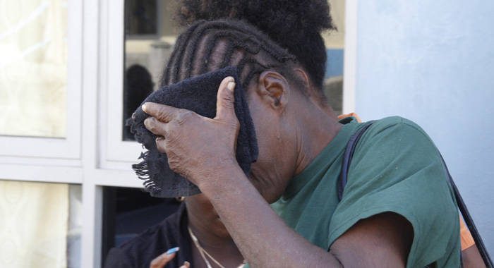 Laverne "Fish" Prince hides her face after leaving court on Wednesday. (IWN photo)