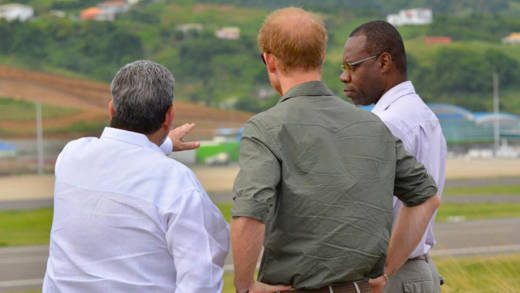 From left: Prime Minister Gonsalves, Prince Harry and Rudy Matthias, head of the International Airport Development Company, look at the airport on Saturday. (Photo: API) 