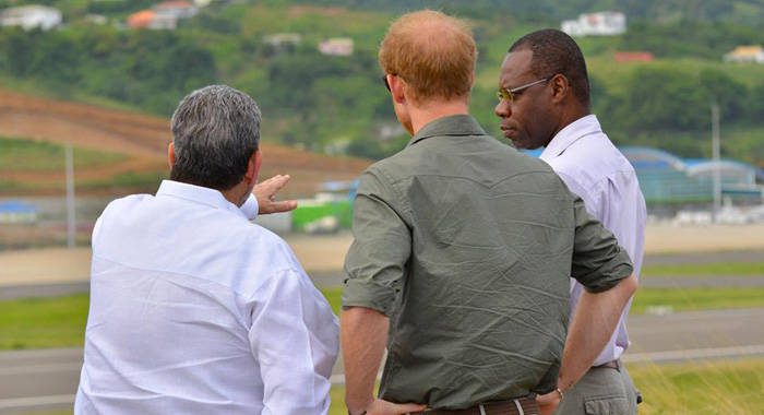 From left: Prime Minister Gonsalves, Prince Harry and Rudy Matthias, head of the International Airport Development Company, look at the airport on Saturday. (Photo: API) 