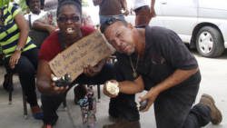 Then-workers at Buccament Bay Resort make their point during a protest over non-payment of wages on Dec. 3, 2016. Opposition Leader Godwin Friday says that the money owed to the workers should be given to them from Harlequin's share of the resort sale deal.  l(IWN photo) 