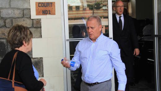 Manager of Harlequin Property, Dave Ames, centre, leaves the High Court in Kingstown on June 22, 2016, where the High Court of England was hearing evidence in a case Harlequin brought against its former accounting firm, Wilkins Kennedy. 