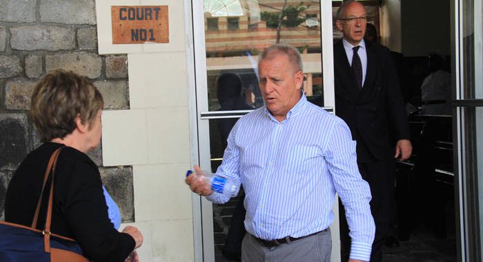 Manager of Harlequin Property, Dave Ames, centre, leaves the High Court in Kingstown on June 22, 2016, where the High Court of England was hearing evidence in a case Harlequin brought against its former accounting firm, Wilkins Kennedy. 