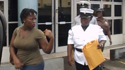 The accused, Latish Williams, leaves the Kingstown Magistrate's Court under police escort.