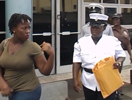 The accused, Latish Williams, leaves the Kingstown Magistrate's Court under police escort.