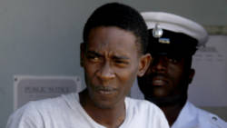 Lara Carter one of the accused men walked amidst the confusion over the charges. (iWN file photo)