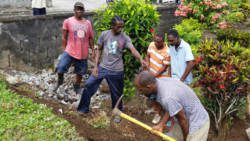 Residents of Chateaubelair came out to assist with the construction of the retaining wall at the Chateaubelair playing field. 