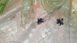 Damage to the curtain from when the gunshot was fired into the house. (iWN photo)