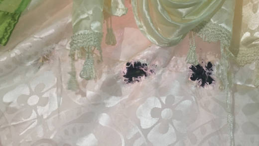 Damage to the curtain from when the gunshot was fired into the house. (iWN photo)
