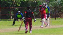 North Leeward's Ronique Laborde (89) belts another boundary.