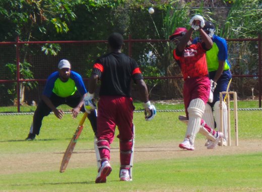 North Leeward's Ronique Laborde (89) belts another boundary.