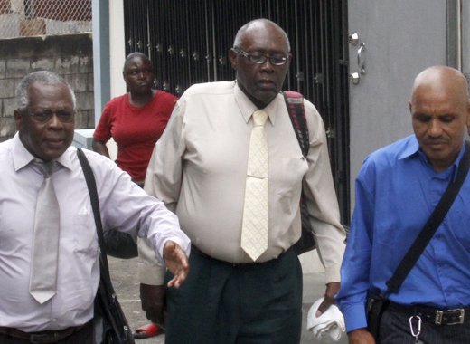 Accused Ehud Myer, centre, former co-accused Colbert Bowens, right, and other persons leave the Serious Offences Court on Monday. (iWN photo)